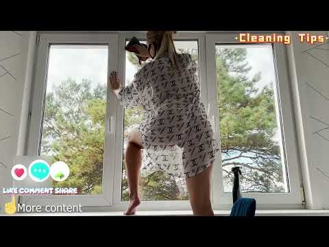 A Sexy Petite Cleaning on Window in a Transparent Dress without Underwear