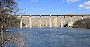 Mansfield dam Colorado River Austin Texas. Dam located across the Colorado River. United States Bureau of Reclamation. Lake Travis flood control and hydroelectric power electricity generator.