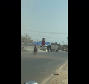 Dust devil tornado tears through roadside in Myanmar