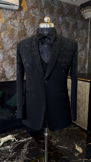 🖤 The Art of Subtle Sophistication 🖤 A timeless statement of class and charisma — this black suit blends refined craftsmanship with intricate bead and thread embellishments. The hand-embroidered shoulder and lapel detailing add a touch of royal grandeur, while the sleek tailored fit ensures a commanding presence. Perfect for evening occasions, receptions, and high-fashion events, this ensemble radiates confidence, power, and effortless grace. The subtle shimmer of the embellishments under soft