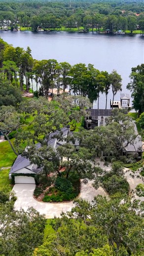 Compass Florida on Instagram: "The pinnacle of lakefront living is found in this ultra-luxury, 4,637 square foot estate, beautifully situated on 1.74 acres with a private beach and 96 feet of coveted lake frontage. This refined home features a fully updated chef’s kitchen, a massive bonus room, dramatic lake-view windows, and extensive outdoor entertaining spaces including a heated saltwater pool and a hurricane-rated dock with a 10,000 lb. boat lift. The private primary suite occupies the entir