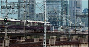 Trains crossing bridge in Osaka, Japan.