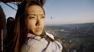 Beautiful Korean Girl flying in a hot air balloon