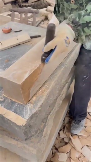 Stonemason Shaping Natural Limestone for Wall Cladding