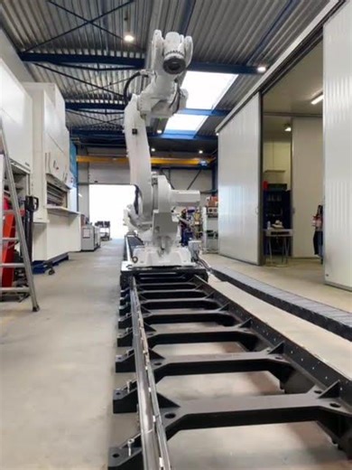 IRS Refurbished Original Graphite White ABB IRB6640 IRC5 robot on a 32 meter ABB IRBT6004 track.
