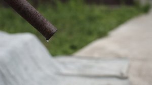 clip-16723111-water-drips-rusty-pipes