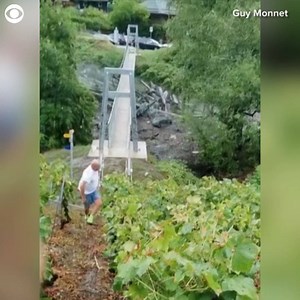 7.3M views | SCARY: Watch the moment a mudslide slammed into a bridge in Chamoson, Switzerland on Monday. Heavy rain in the Swiss Alps caused flooding and landslides in the area. | CBS Newspath | Facebook