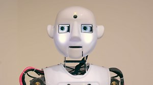 Close-up Of The Robot. The Robot's Head And Eyes Move. A Humanoid Robot With Artificial Intelligence