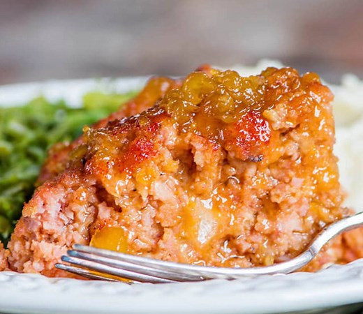 GLAZED HAM LOAF How do you like to use up leftover ham? This ham loaf recipe is one of the best ways to use up leftover ham. Baste with a sweet pineapple glaze during baking for a delicious caramelized flavor. PRINT IT: https://www.tastesoflizzyt.com/ham-loaf/ | Tastes of Lizzy T