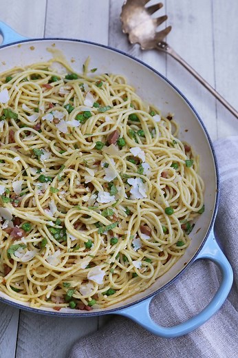 Tiffani Thiessen's spring pea and pancetta carbonara turns fresh spring flavors into a classic, comforting pasta. It's the perfect recipe to welcome the new season! Watch how she makes it here and get the full recipe in her cookbook, Pull Up a Chair. Shop Tiffani's Braiser in Sea Salt: http://bit.ly/2JsPkdm and her Round Dutch Oven in Meringue: http://bit.ly/2JvcVKm. | Le Creuset