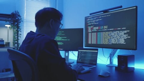 clip-4148293641-concentrated-programmer-coding-watching-analysis-source ...