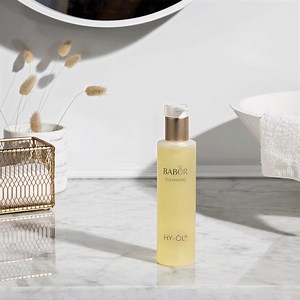Our professional-grade bi-phase cleansing system is the perfect cleansing duo for all skin types! Choose from one of our 4 Phytoactives; Sensitive, Hydro-Base, Combination, and Reactivating. Step 1: Apply 4 pumps of HY-ÖL to dry skin and massage (do not moisten the skin beforehand) Step 2: Smooth 2 pumps of a Phytoactive on top of it and massage into skin. Using moistened fingers, massage into the skin until a milky emulsion forms. Rinse off thoroughly with plenty of cool water. | BABOR