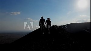 Cinematic view of tourists hiking the Cerro Negro Volcano in Nicaragua