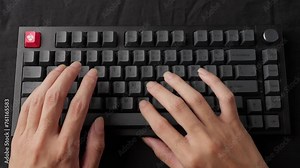 Hands typing rapidly on a mechanical keyboard, clear audible clicks, focus on fingers, indoor setting