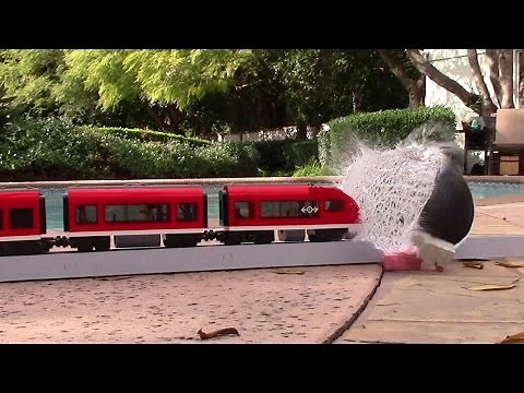Lego trains crashes in to a water balloon