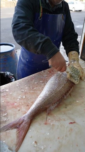 How to Scale a Fish Like a Pro in an Asian Fish Market