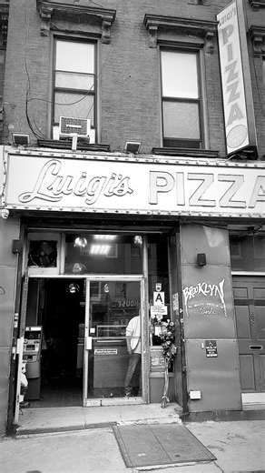 @mattyeaats on Instagram: "Luigi’s Pizza opened its doors in Park Slope in 1973, when Italian immigrant Luigi Lanzo founded the neighborhood pizzeria on 5th Avenue, quickly becoming a go-to spot for classic New York slices with fresh ingredients and an old-school vibe. ￼ Giovanni (Gio) Lanzo, his son, took over the family business in 1999, continuing the tradition and keeping the shop rooted in its community. ￼ Over the decades, Luigi’s has remained a beloved slice institution for locals and vis