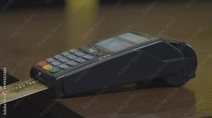 Credit card machine chip and pin code being entered by a man POV. A detail zoomed in of the hand with no faces shown. In 4K, real time. Credit or debit card being used for consumer spending.