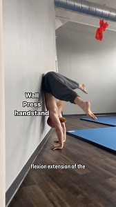 This wall press handstand drill, when performed correctly, is a great way to develop the connection between the hips, spine, and shoulders when performing the press. it takes out the concern for maintaining balance, and the wall can provide a tactile cue for where you are in the movement. The idea is to isolate flexing the hips to compress the legs, and then curling the spine to roll against the wall. This should all be done while keeping the shoulders as open as possible. no, this does not repl