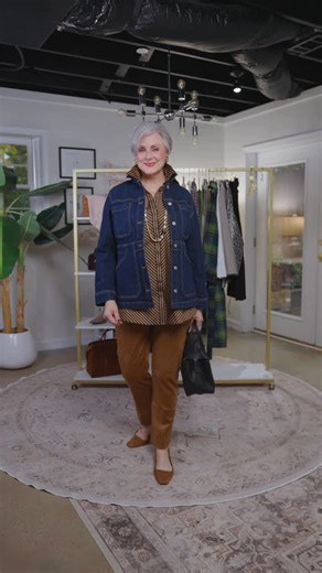 Beth Djalali on Instagram: "Classic, not boring. The hero piece this week? A denim field jacket — longer lines, modern silhouette, endlessly versatile. I layered it with a striped tunic, faux suede pants, and pearls for polish. Add suede slingbacks and a black leather satchel, and you’ve got effortless sophistication with a fresh twist. ✨ @lovechicos ⬇️ Want the outfit links? Type DENIM in the comments and I’ll send them straight to your DMs. #ClassicNotBoring #GritAndGlam #StyleAtACertainAge #F