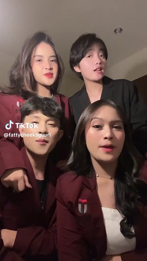 Candid Moments of Friendship in Matching Red Jackets