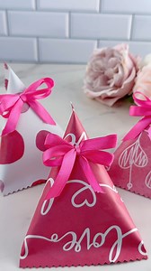 A small candy box for Valentine’s Day with a simple fold and a ribbon. Cute way to pack little sweets. #ValentinesDay #giftideas #treatbox #papercraft #valentinegift #handmadegift #candybox #valentinecraft | Bloom&Craft