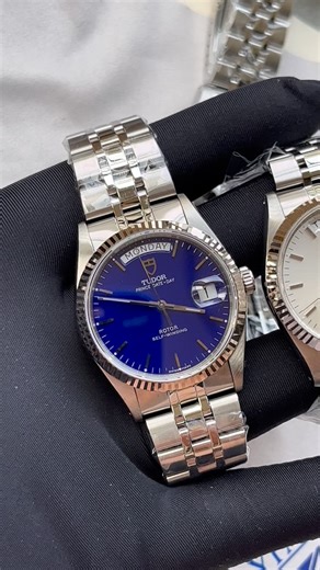 Chris on Instagram: "🔥Two absolute stunners! The Tudor 76214 range comes with double quickset DD feature, making day and date changes easy peasy. 💫 We’ve a full set NOS available now, with the early blue dial which is lighter than the later updated version, with the changed font that you’ll see on the SB on the right. Two of Tudor’s finest, made instantly recognizable by that solid 18k white gold fluted bezel. Pure class on the wrist. 🔵🪙🌅"