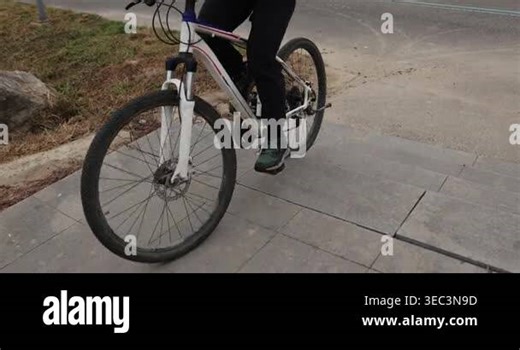 Woman freerider riding bike up stairs outdoors Stock Video Footage - Alamy