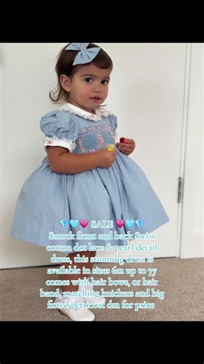 💎🩵💗 SALE 💗🩵💎 Smock front and back Swiss cotton dot lace & pearl detail dress, this stunning dress is available in sizes 6m up to 7y comes with hair bows, or hair band, matching knickers and big fitted petticoat dm for price #fyp #viralvideos #smockeddress #smocking #girlssmockdress @𝒞𝒩 modeling this dress she’s beautiful