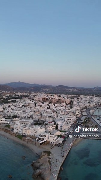 Turning from the ancient Portara, the view opens to the heart of Naxos—the whitewashed alleys, the iconic Venetian castle, and the vibrant town unfolding by the sea. History, Cycladic charm, and timeless beauty all in one frame. 📍 Naxos, Greece 🎥 Shot with DJI Mini 4 Pro #naxos #naxosisland #cyclades #greecevacation #castleview #djimini4pro #dronephotography #travelgreece #visitgreece #aerialview #naxoscastle #choranaxos #naxosdrone #portaragreece #greekislands #mediterraneanvibes #islandhoppi