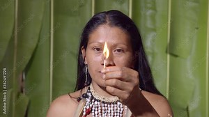 Woman Lighting A Match And Showing It To The Viewer