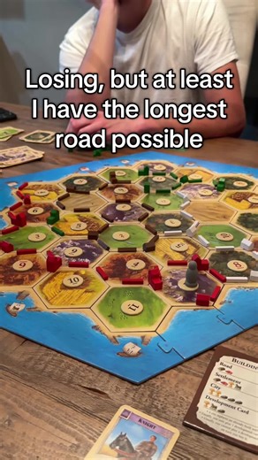 Enjoying a Fun Game of Catan with Friends