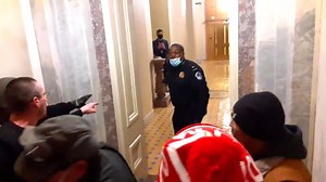 Video shows cop leading mob away from Senate chamber where Pence was located