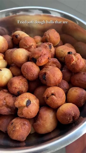 Delicious Fried Raisin Dough Balls with Cream Sauce