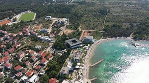 Town of Novalja Waterfront View On The Island Of Pag In Croatia - aerial drone shot