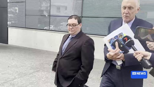 Michael Slater's lawyer Greg McGuire leaves court after the former test cricketer's failed bail application.