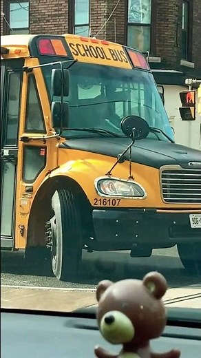 2 school buses turning on a busy street!