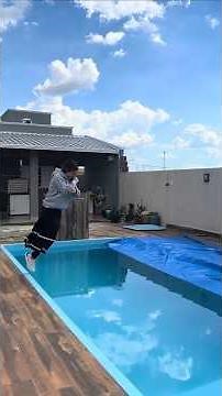 Jump in the pool fully clothed wearing sweatshirt, long skirt, tights, socks and shoes