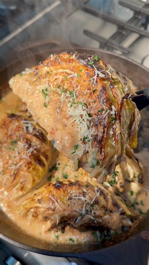 Destiny symone on Instagram: "Garlic parm melting cabbage 🥬 🤤 this was soooo good! inspo: @boydbrown3 Ingredients: Cabbage Olive oil Salt Pepper Italian seasoning Cajun seasoning 2 1/2 cups chicken broth 2 tbsp butter 1/2 small onion 2 tbsp minced garlic Cornstarch slur (to thicken sauce if needed) Parsley Cream cheese Grated Parmesan cheese"