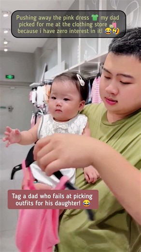 cute baby 😘 rejecting dad pink dress pick at clothing store! 😍