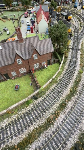 British Rail Class 121 "Bubble Car" number 121027 passes the village