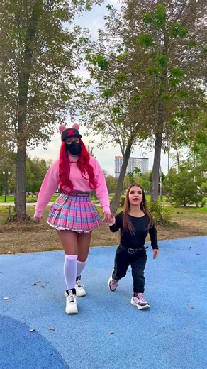 Exploring Playground Fun: Adult and Child at the Slide