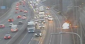 Motorway chaos as two cars set alight and crash leaves man seriously injured