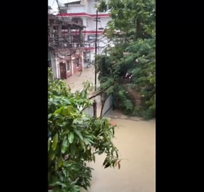 Floodwater torrents surge through streets in eastern India