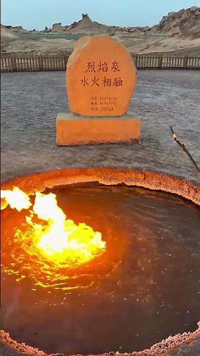 Natural Flame Spring burns atop bubbling water in Xinjiang, China