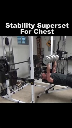 Stability Supersets For Building a Bigger Chest... this is a very simple concept and is extremely effective for putting more mechanical tension on the chest for growth. I posted this yesterday but it for some reason ended up with music over top of my narration. Essentially, you're going to start with the less stable version of the bench press... Dumbbell Bench Press. Aim for 5 to 7 reps, keeping the do-or-die rep in reserve. Immediately set the weight down and go right to the MORE stable version