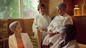 Group of mature women in a sauna in a luxury spa, enjoying and having...
