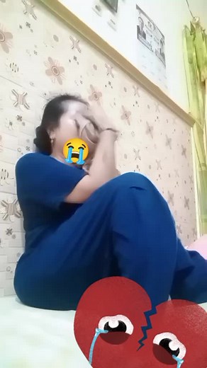 Emotional Moments: A Woman's Reflection in Bed