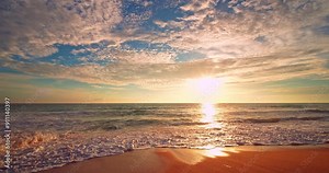 Beautiful sea sunrise or sunset sky over sea,Amazing sky and shining golden waves landscape,Slow motion waves crashing on sandy shore,Beach Sea sky nature background