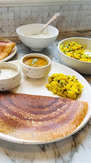 2.4M views · 370 reactions | Craving South Indian flavors without the wait?  Instant quinoa oats dosa to the rescue!  Packed with protein-rich quinoa and no need for batter fermentation, it’s my quick fix for dosa cravings. Thin, crispy, and oh-so-satisfying! Drop a “Dosa” in the comments for the recipe sent straight to your DMs!  #easyrecipe #instantdosa #desifood #indiancuisine https://ministryofcurry.com/quinoa-dosa/ | Ministry of Curry | Facebook